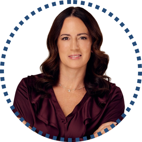 Professional woman with long, wavy hair, wearing a dark blouse, symbolizes focus on rural health initiatives, framed by a blue patterned border.