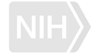 NIH logo in gray, with bold letters 'NIH' inside a right-facing arrow, representing their focus on rural health initiatives.